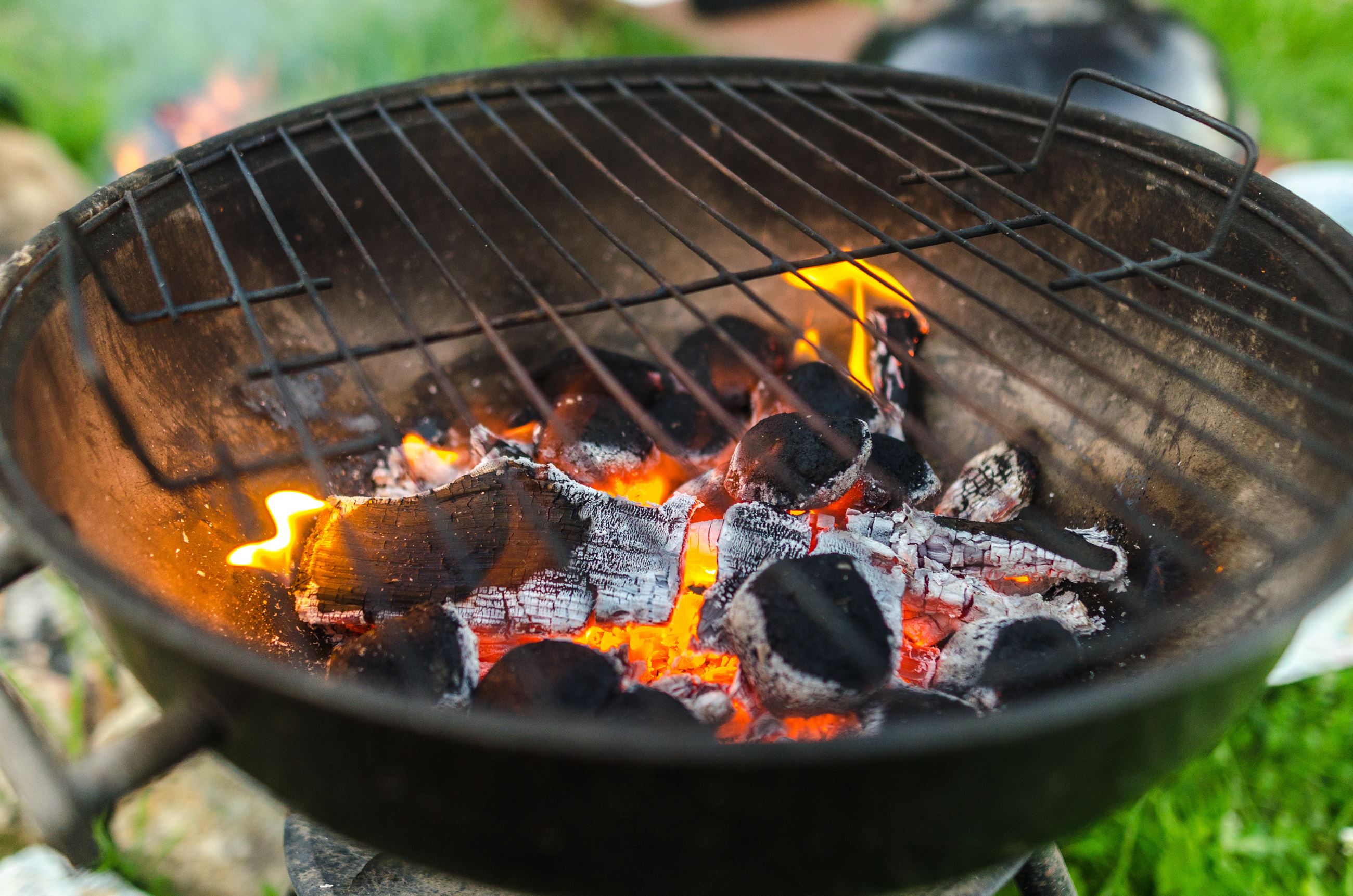 Image of charcoal grill with burning coals.